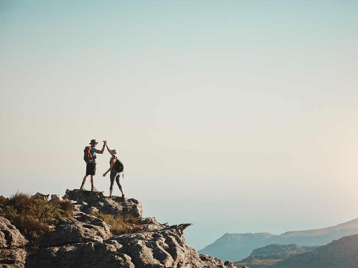 Illuminate Counselling North Vancouver, BC couple on top of mountain peak