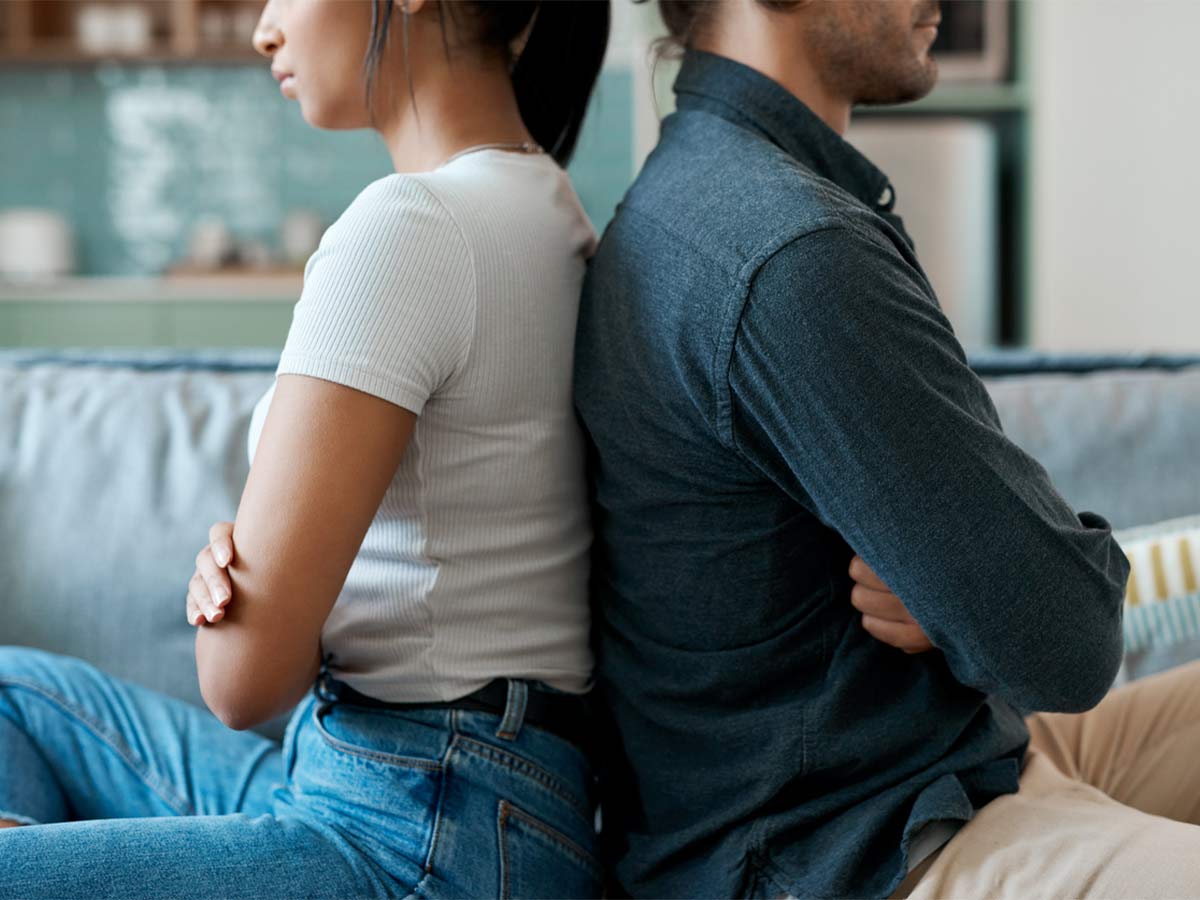 Illuminate Counselling North Vancouver, BC couple sitting together with backs to one another
