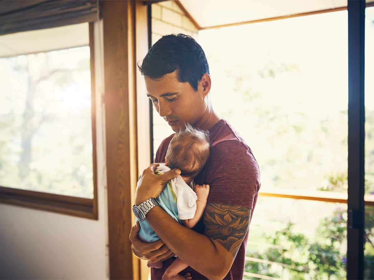 Illuminate Counselling North Vancouver, BC man holding a baby